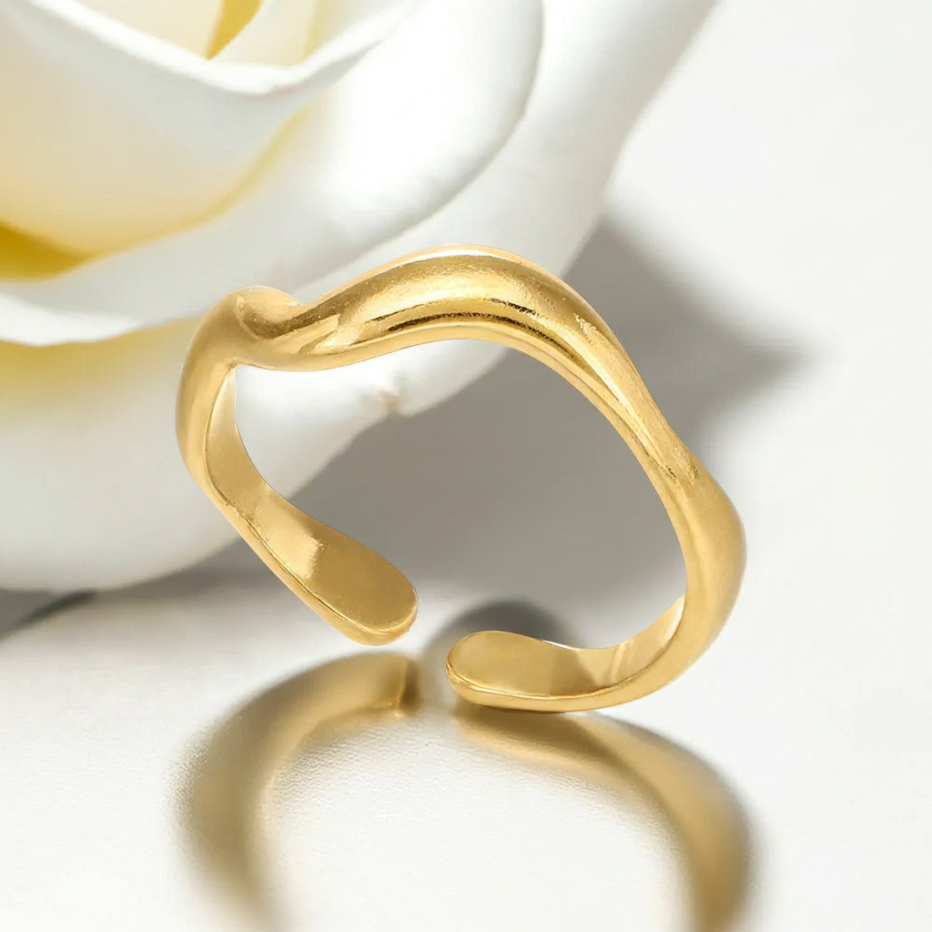 Gold open ring on a white background