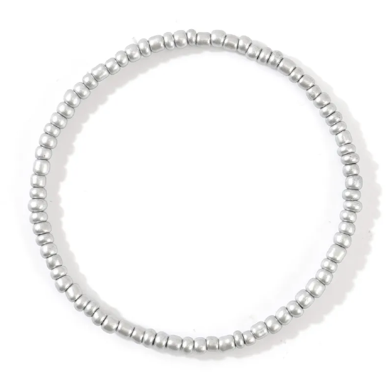 Silver beaded bracelet on a white background