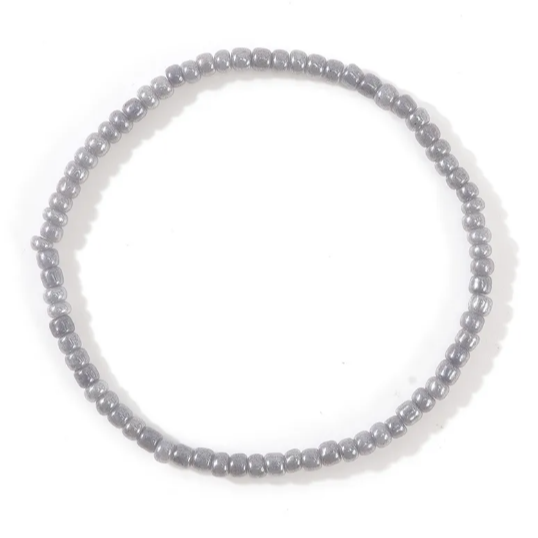 Gray beaded bracelet on a white background