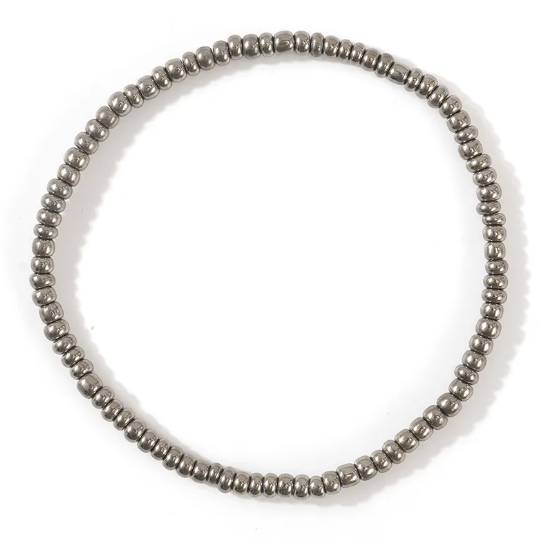 Silver beaded bracelet on a white background