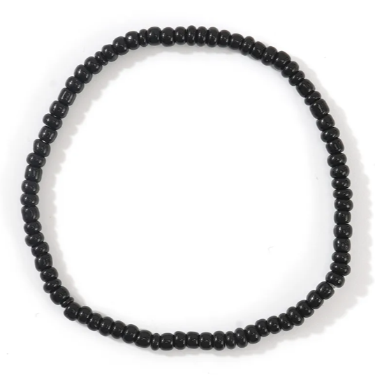 Black beaded necklace on a white background