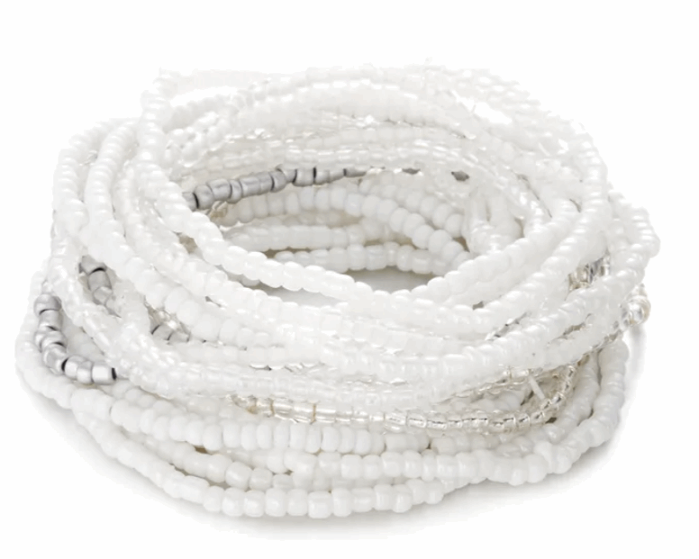Stack of white beaded bracelets on a white background