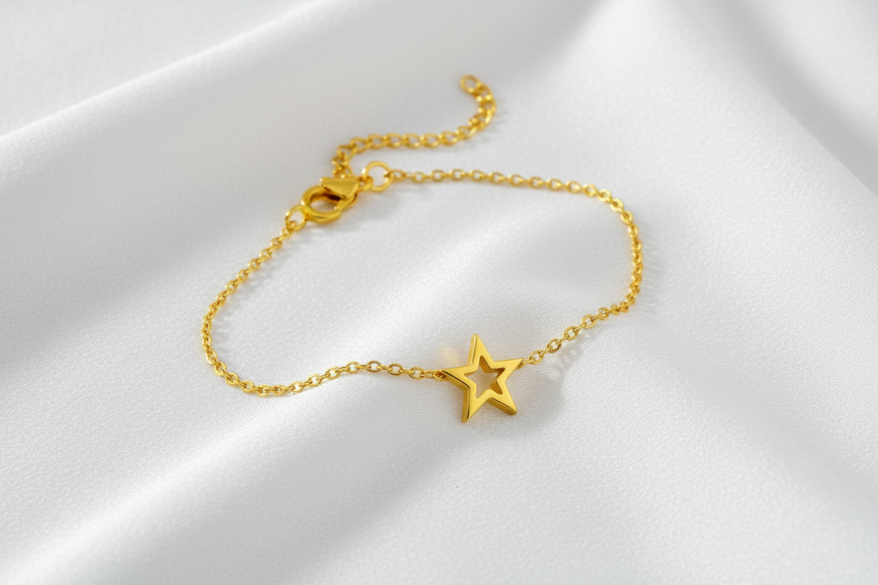 Gold chain bracelet with blue eye charms and lobster clasp, elegant and stylish accessory.