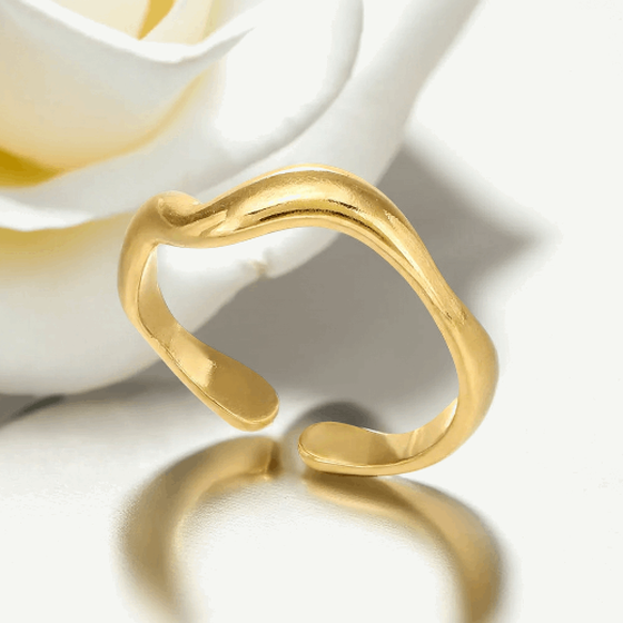 Gold open ring on a white background