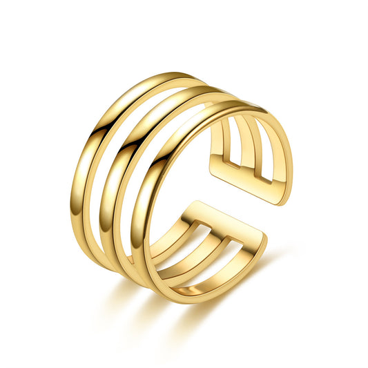 Gold open ring with three horizontal bands on a white background